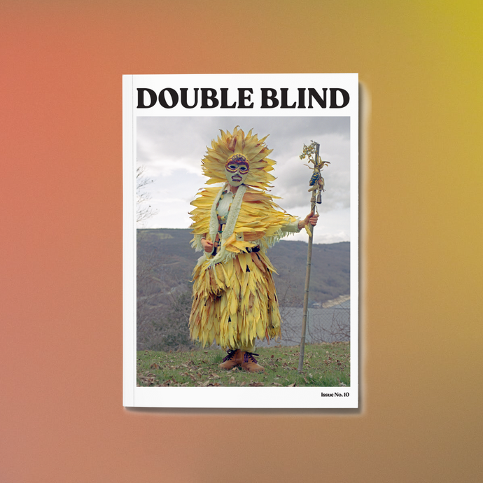 DoubleBlind Magazine Cover featuring a person with a yellow flower costume
