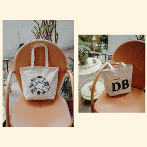 DoubleBlind: DoubleBlind Tote bag on a chair.